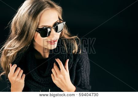 Close-up portrait of a beautiful woman in black sunglasss.