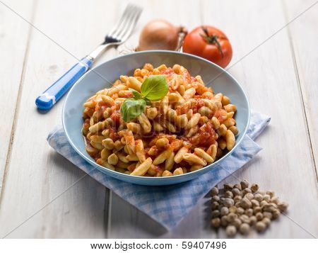 pasta cavatelli with chickpeas and tomatoes, selective focus