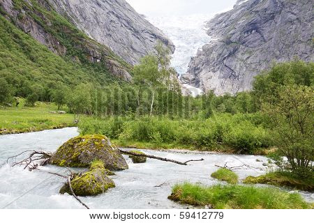 The Mountain Landscape With The Briksdal Glacier In Norway