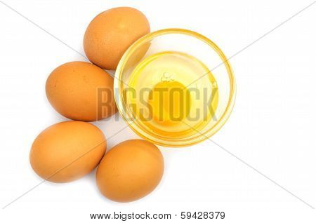 egg yolk in a glass cup on a white background