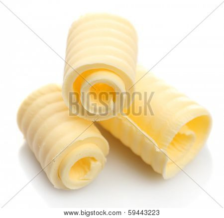 Curls of fresh butter, isolated on white