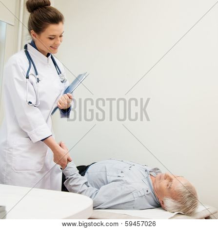 Senior man lying at daybed at doctor's office