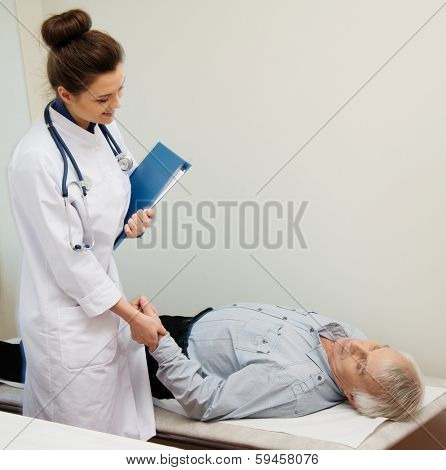 Senior man lying at daybed at doctor's office