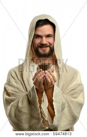 Jesus smiling and holding communion cup isolated over white background