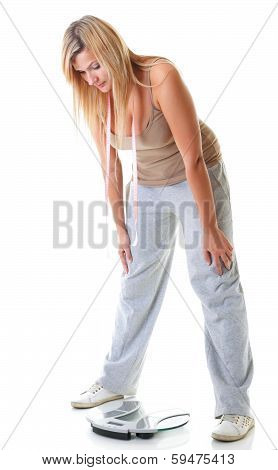 Large Woman With Scale Measuring Her Weight