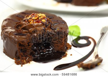 Chocolate dessert with melted chocolate running from inside
