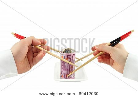 Hands taking euro banknote in the form of sushi stuffed with coins on a plate on white background