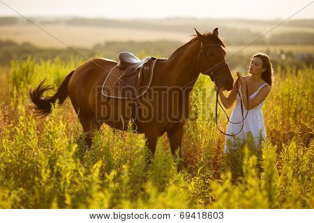 Happy Girl Near To A Horse