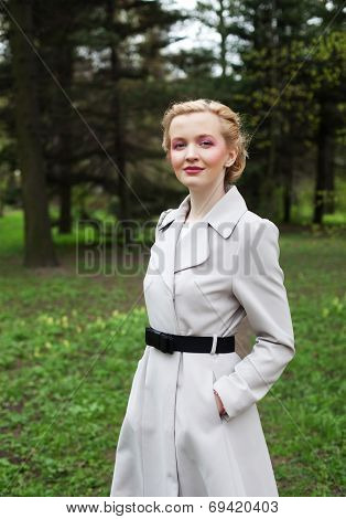 Young fahion woman in the summer garden