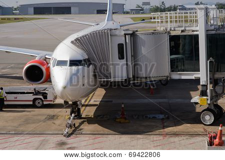 KUCHING - MAY 06: docked jet Airasia airplane on May 06, 2014 in Kuching, Malaysia. AirAsia Berhad is a Malaysian low-cost airline headquartered in Kuala Lumpur, Malaysia