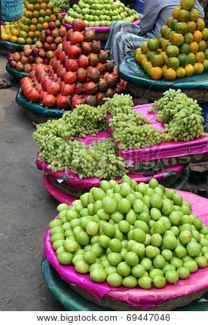 KOLKATA, INDIA - FEBRUARY 15: Street trader sell fruits outdoor on February 15, 2014 in Kolkata India. Only 0.81% of the Kolkata's workforce employed in the primary sector (agriculture)