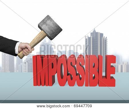Hand Holding Hammer To Creak Impossible 3D Word