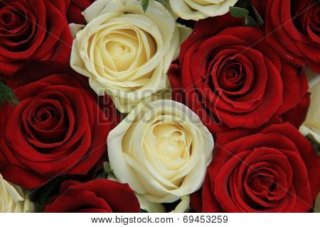 Red And White Roses In A Wedding Arrangement