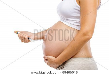 Pregnant woman with syringe