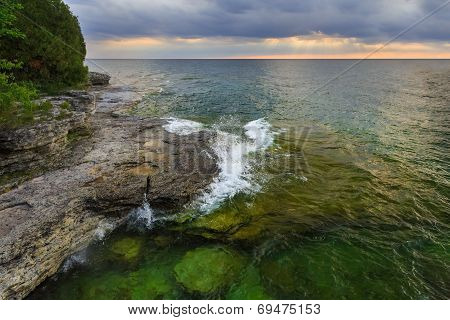 Sunrise Over Rocky Coastline
