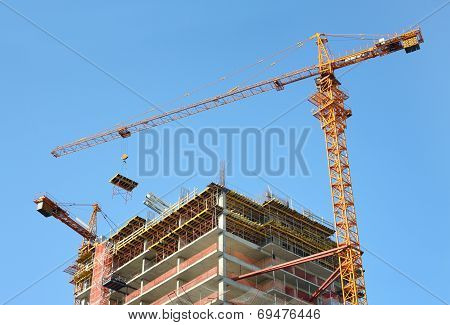 Construction site. High-rise Building Under Construction. Housing crane operation.