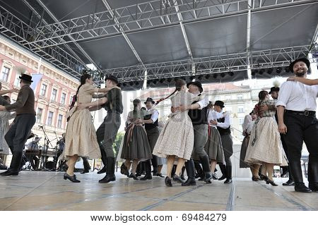 ZAGREB, CROATIA - JULY 19: Members of folk groups Nograd  from Salgotarjan, Hungary during the 48th International Folklore Festival in center of Zagreb, Croatia on July 19, 2014