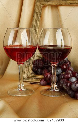composition of frame,wine and grapes on bright background