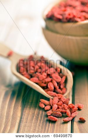 dried goji berries on old table