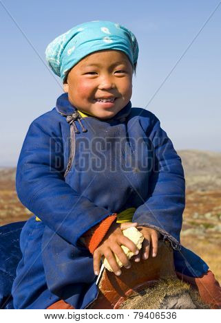 Young Tsaatan girl with a beautiful smile (reindeer people), northern Mongolia.