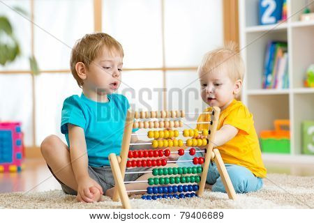 kids playing with abacus