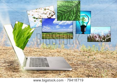 Laptop and eco theme images on nature background