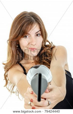 Hairdresser Holding Hairdryer Like Gun And Pointing At Camera Wiith Curious Face Expression