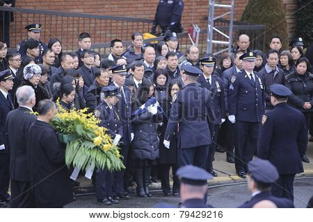 Pei Xia Chen with folded NYPD flag
