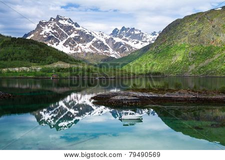 Small Fishing Boat In Scenic Fjord On Lofoten, Norway