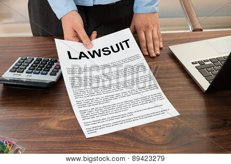 Lawyer Showing The Lawsuit Document