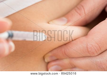 Patient Making Insulin Shot By Use Of Syringe