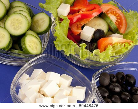 Picture Of Plates With Greek Salad And Ingridients