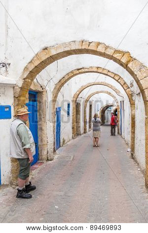 tourists family visit an old alley in Safi, Morocco