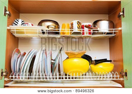 Dirty Grubby Drainer With Clean Dishes In Kitchen.