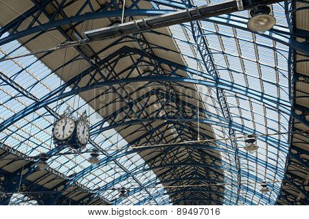 April 2015 - Brighton, England: Train station At Brighton Looking Up The Roof And Clock