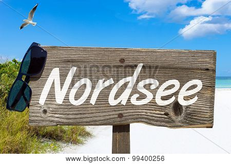 Wooden Signboard On The Beach