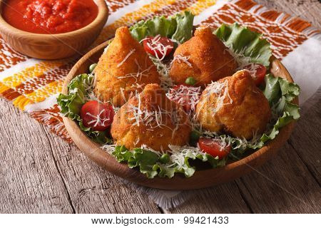 Rice Balls Stuffed With Meat And Tomato Sauce Closeup. Horizontal