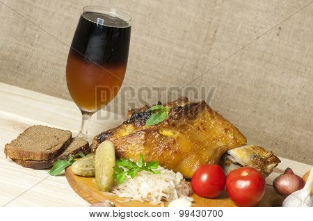 Roasted Pork Leg Served With Sauerkraut And Sliced Beer