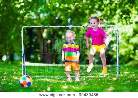 Kids Playing Football In School Yard
