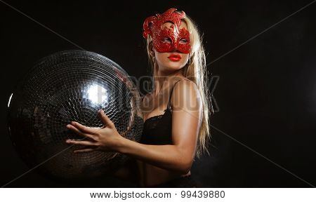 lady in mask with disco ball