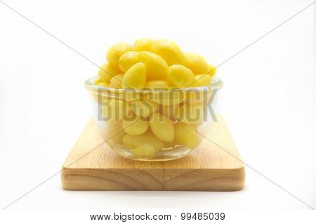 Cup of boiled Ginkgo nut on wooden board