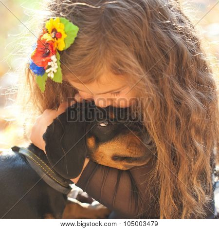 Little Kid Kissing And Hugging Puppy.
