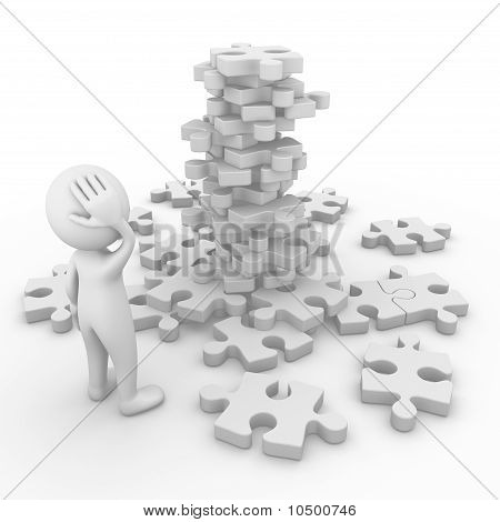 Homme face à une montagne de puzzle