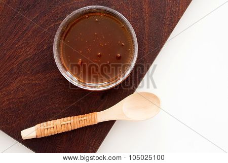 Golden Honey In A Glass From Above - Studio Shot