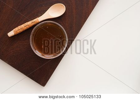 Golden Honey In A Glass From Above - Studio Shot