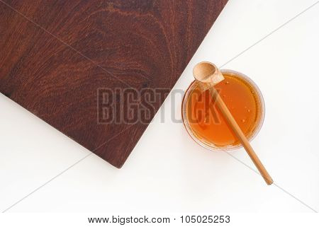 Golden Honey In A Glass From Above - Studio Shot