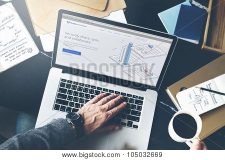 Bangkok, Thailand - October 14, 2015: Man on a Computer Browsing Dropbox Website