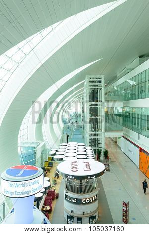 DUBAI, UAE - APRIL 18, 2014: the interior of Concourse A. The concourse includes one 4 star hotel and one 5 star hotel, first and business class lounges, and duty-free areas