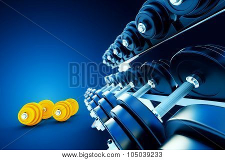 Row Of Metal Dumbells With Orange Dumbbells On Blue Background