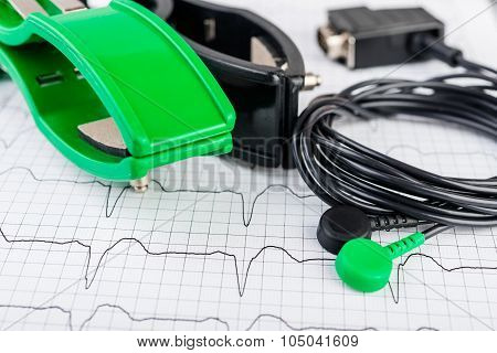 ECG electrodes  on the background of the electrocardiogram